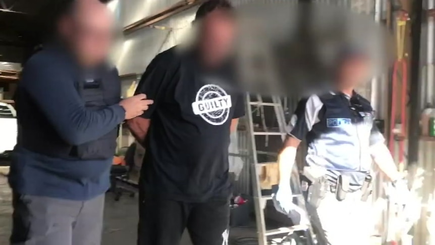 A blurred photo of a man arrested over a drug bust.