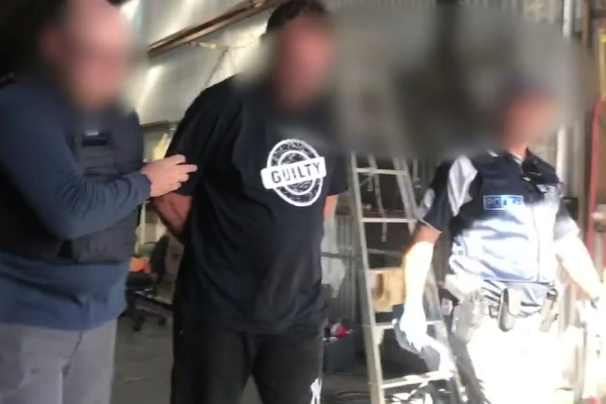 A blurred photo of a man arrested over a drug bust.