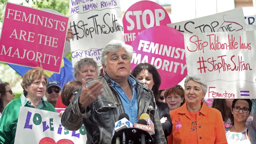 Jay Leno speaks at a rally of women's groups and homosexual rights groups protesting outside the Beverly Hills Hotel.