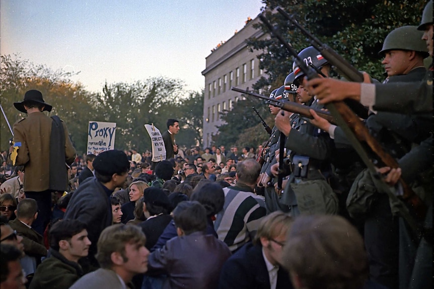 Members of the military police keep back protesters during their sit-in at the Mall Entrance to the Pentagon, Washington, DC.