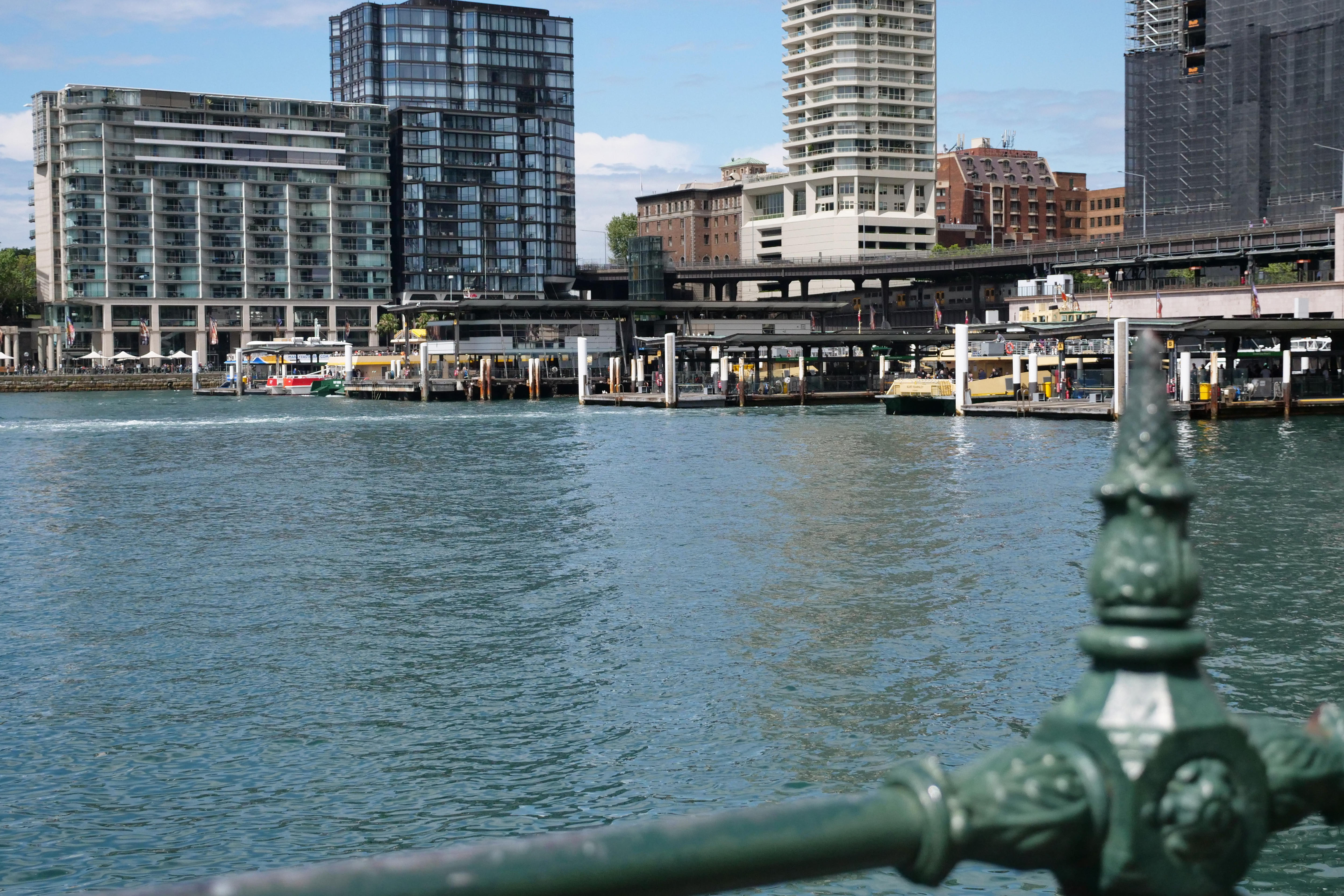 A ferry wharf and high-rise buildings.