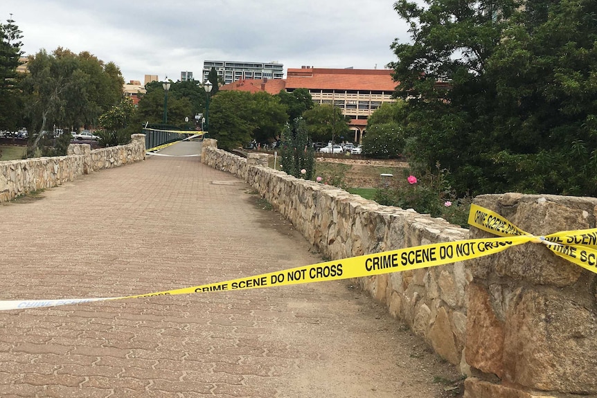 Police cordon off an area near the River Torrens