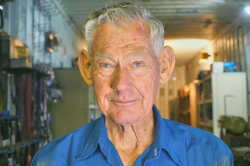 A close shot of an elderly man looking at the camera