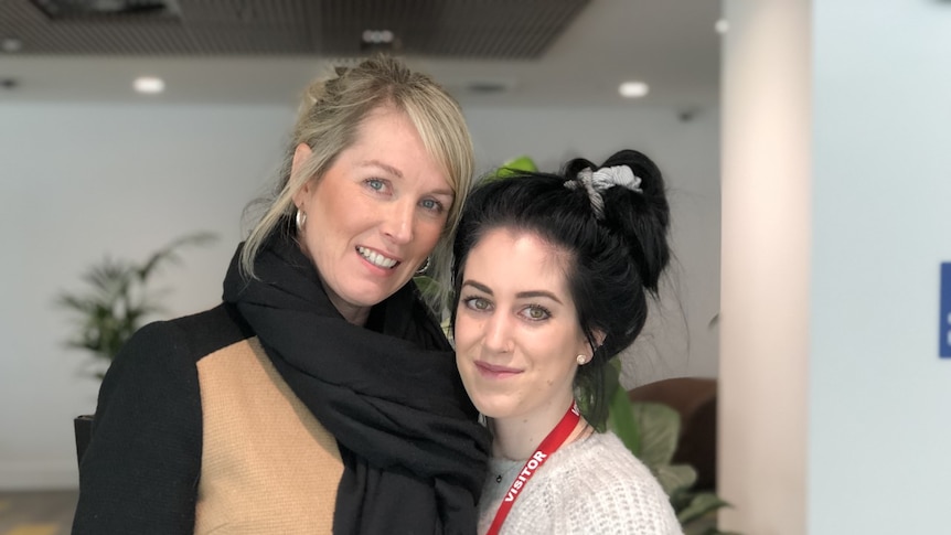 Cherie Short standing with Kayla Caccaviello in the ABC building in Southbank