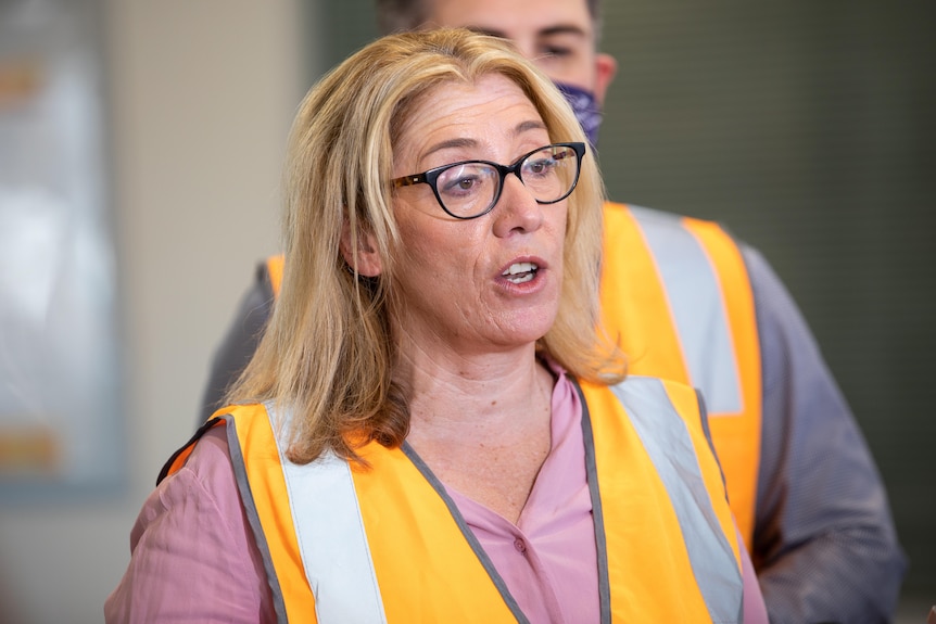 Rita Saffioti speaking at a press conference wearing a high-vis jacket.
