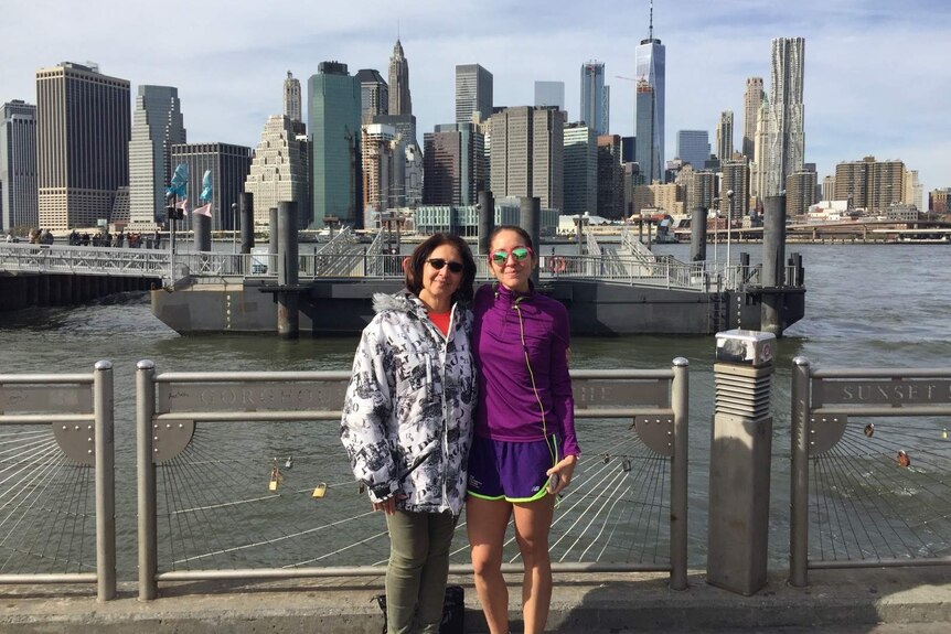 Two women standing near a dock in New York City