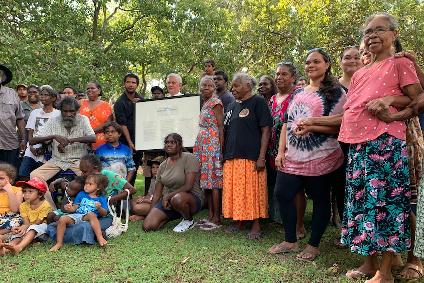 Indigenous Affairs Minister Ken Wyatt poses for a photo with traditional owners at Kakadu National Park.