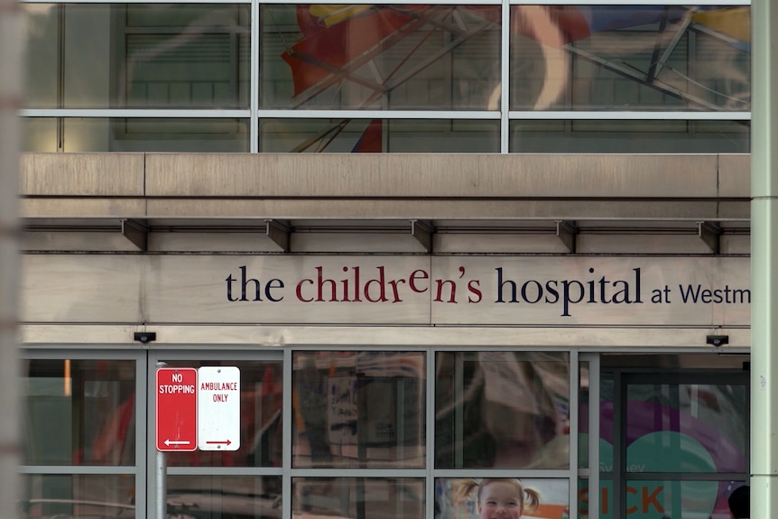 A sign above the entrance to a hospital building which says 'the children's hospital at Westmead'.