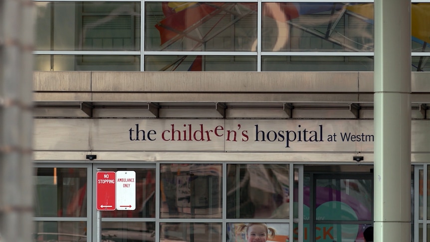 A sign above the entrance to a hospital building which says 'the children's hospital at Westmead'.