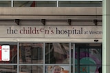 A sign above the entrance to a hospital building which says 'the children's hospital at Westmead'.