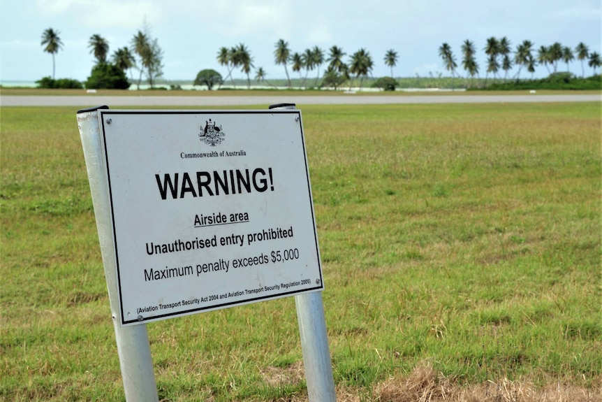 A sign warning that unauthorised entry to the Cocos island runway is prohibited. 