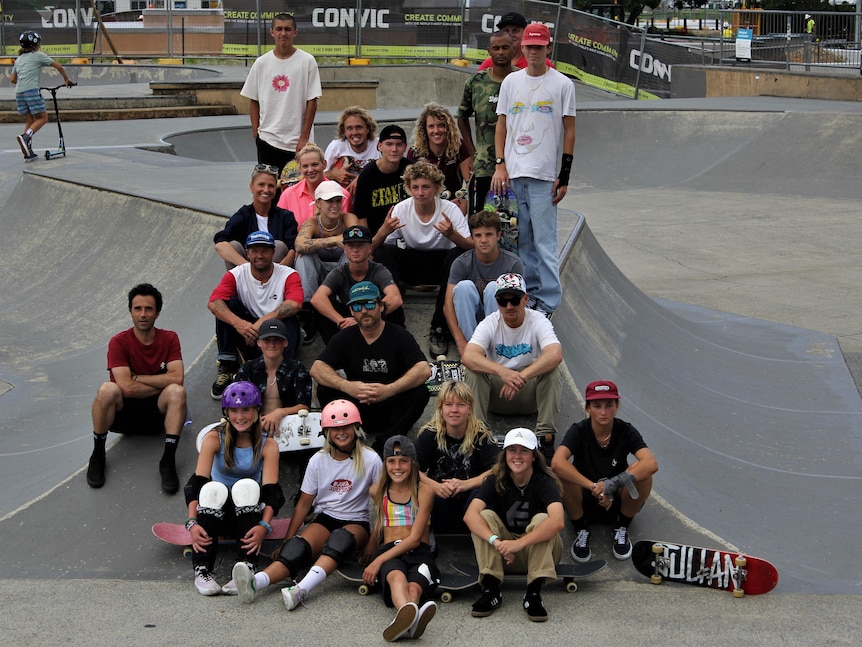 group of skateboarders in a skatepark