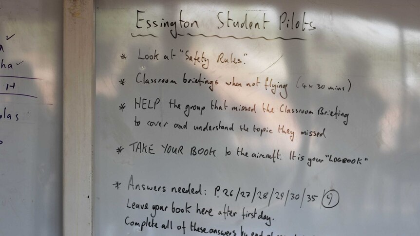 A whiteboard with the title "Essington Student Pilots" and words underneath.