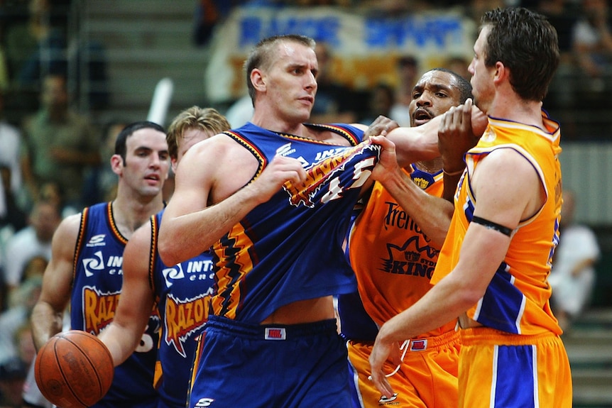 Razorbacks and Kings players tussle during an NBL game in the 2003/04 season.