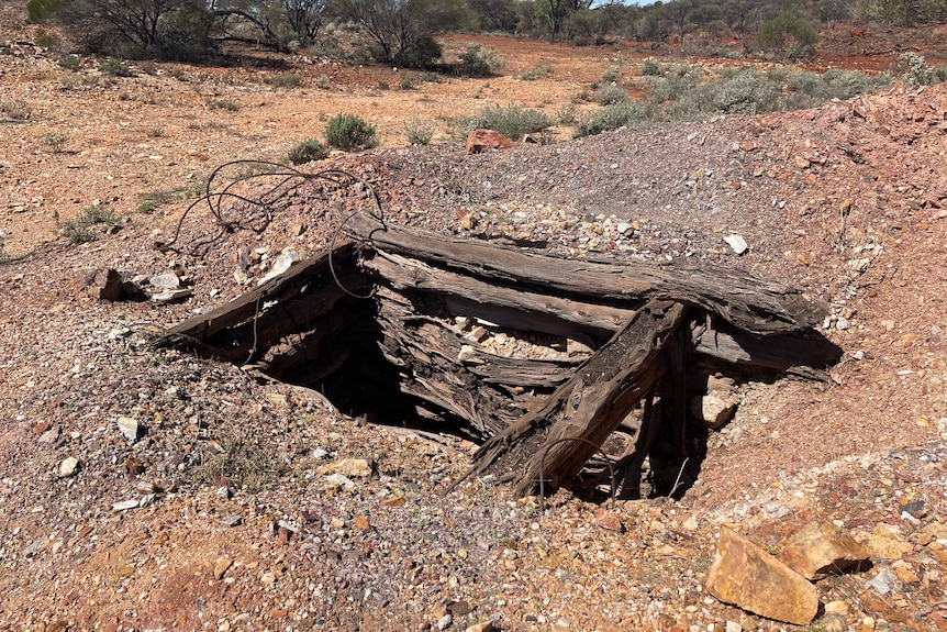The top of a mine shaft in an outback setting