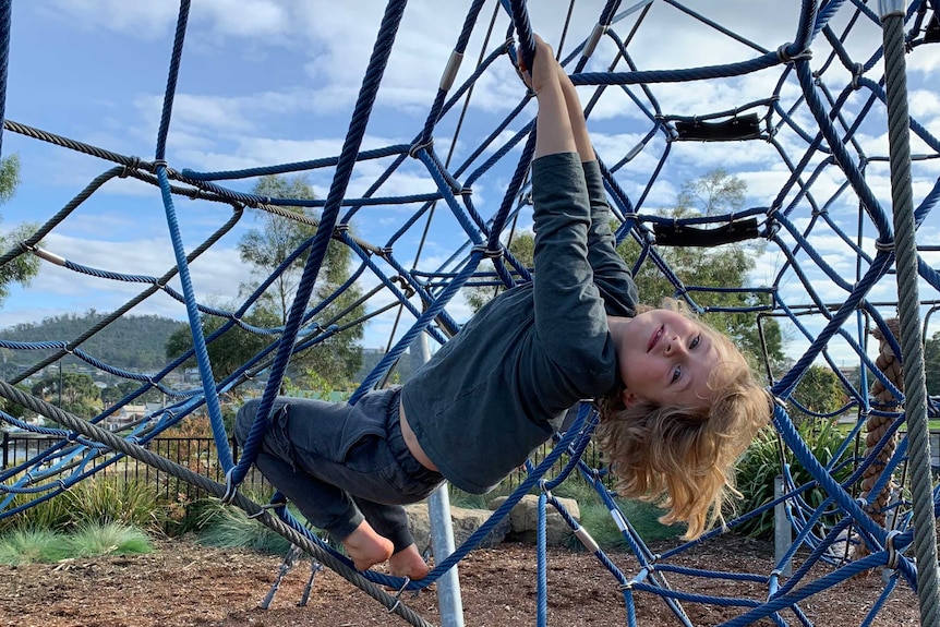 A child playing on a playground in Hobart, May 2020.