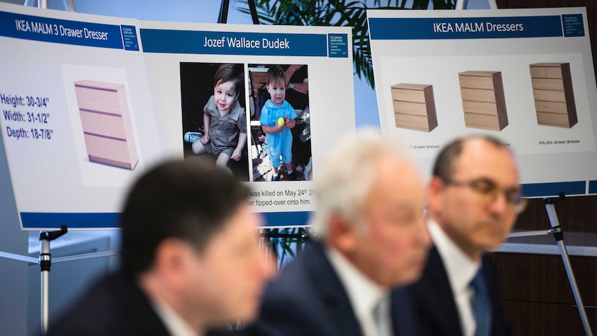 Placards showing images of Jozef Dudek and Ikea's Malm dressers are displayed during a news conference in Philadelphia