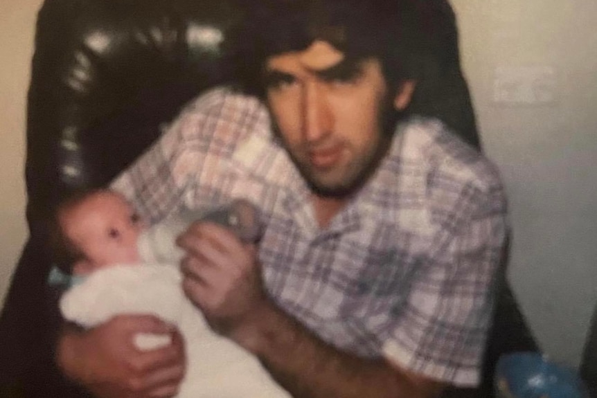 Donald Buckley Jr holding his baby Donna in 1997