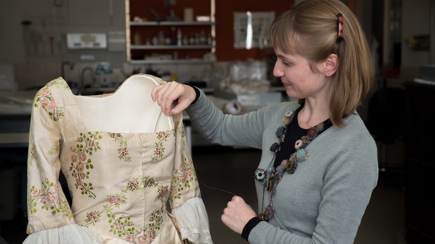 Mary-Anne Gooden works on a 1750s dress