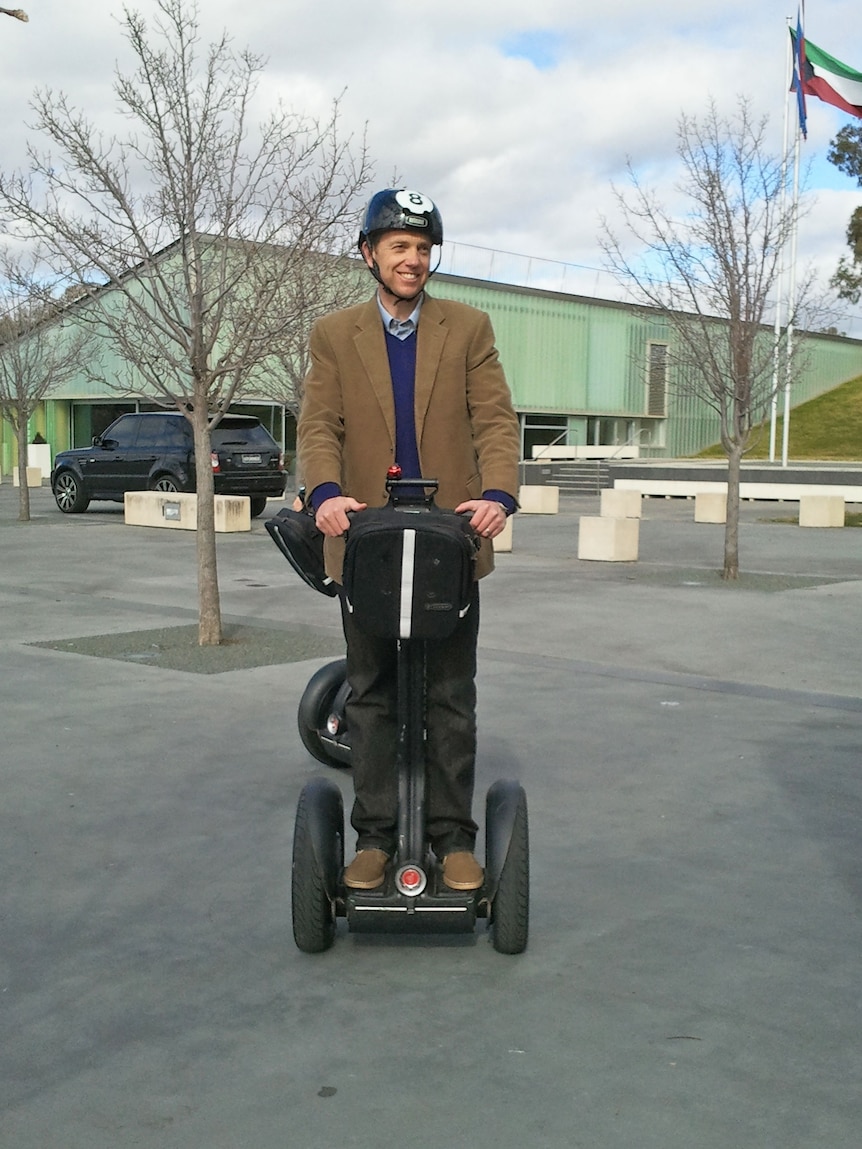 Attorney-General Simon Corbell takes a Segway for a ride.