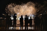 People watch on at the Territory Day fireworks celebrations at Mindil Beach in 2021.