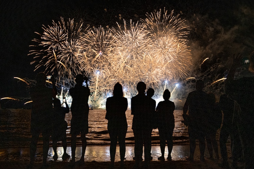 People watch on at the Territory Day fireworks celebrations at Mindil Beach in 2021.