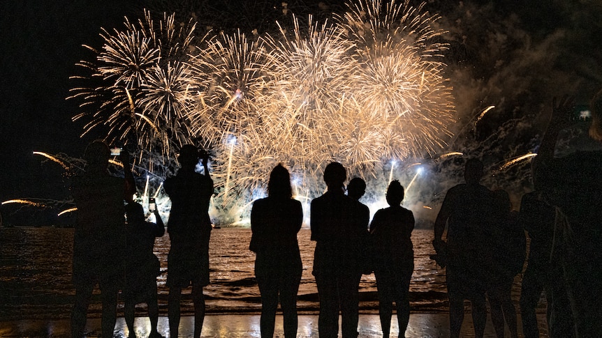 People watch on at the Territory Day fireworks celebrations at Mindil Beach in 2021.