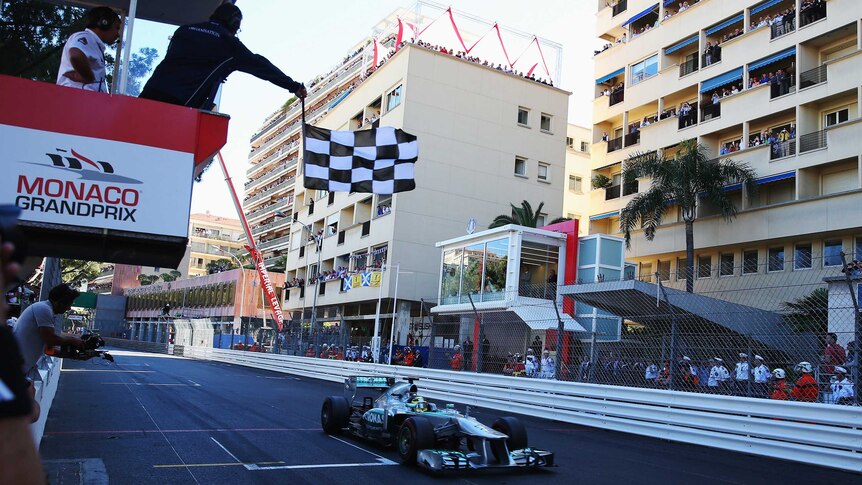 Nico Rosberg receives the chequered flag to win the Monaco Grand Prix.