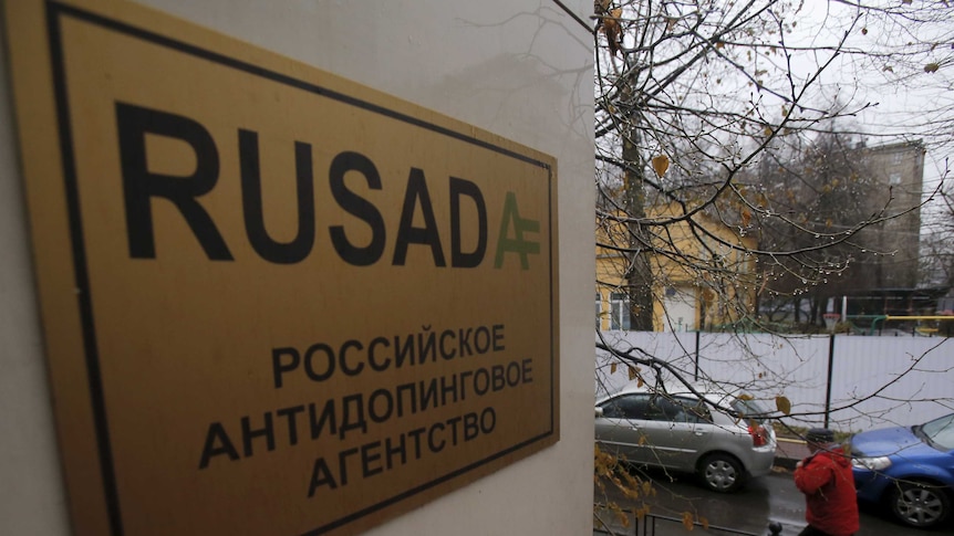 A man walks outside an office of the Russian Anti-Doping Agency.