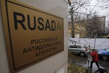 A man walks outside an office of the Russian Anti-Doping Agency.
