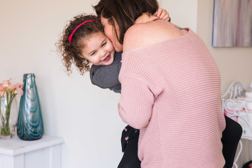 Christielee Plumridge kisses her three-year-old in Cambden to depict the best parts of parenting.