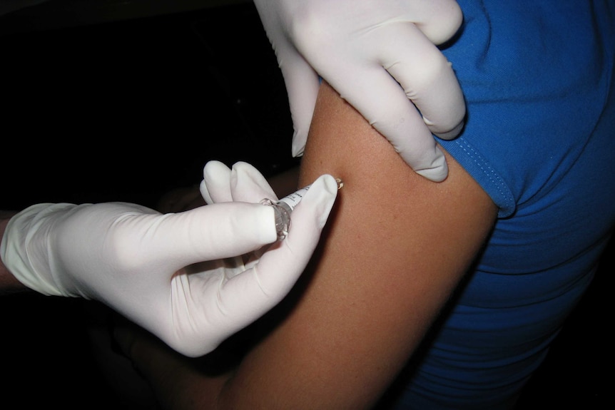 a flu shot being administered.