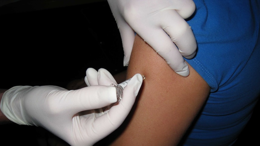 a flu shot being administered.