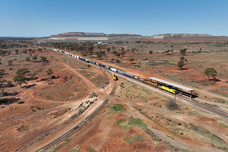 A freight train parked up waiting to move in an outback location.  
