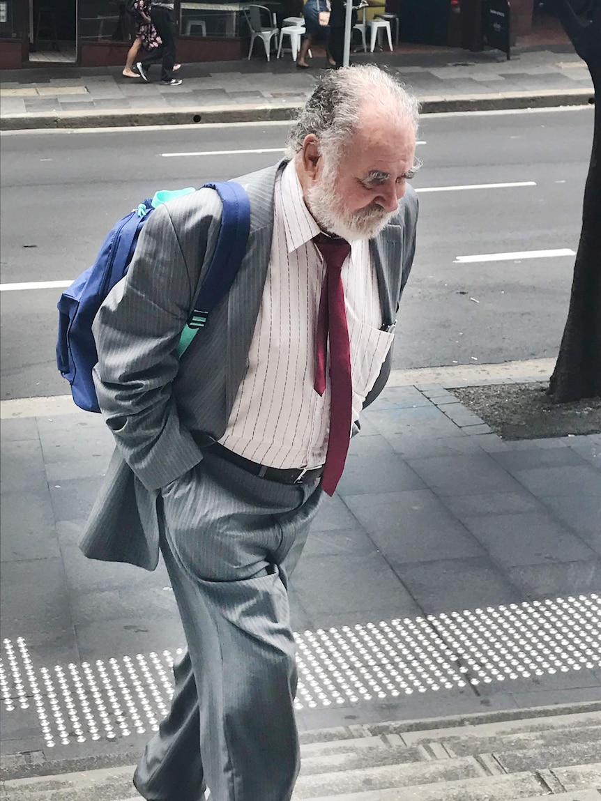 A man walks up stairs.