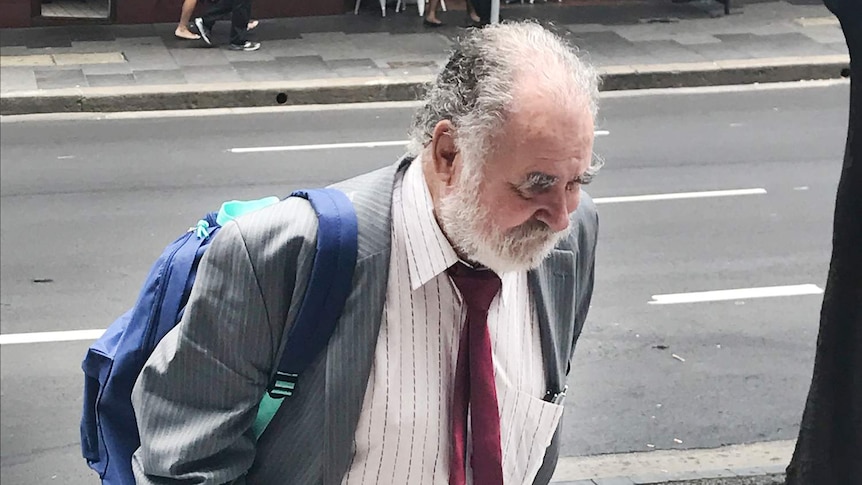 former doctor graeme reeves walks up stairs at the district court in sydney