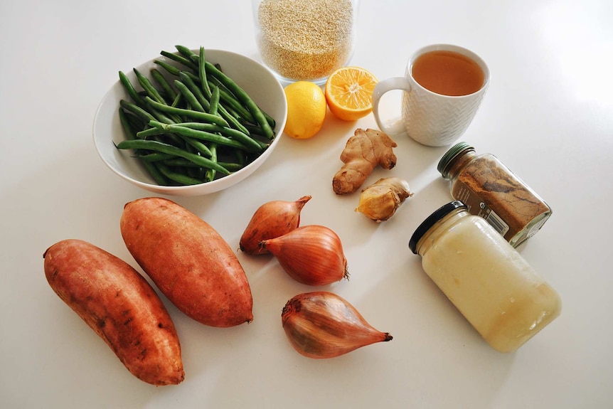 Sweet potatoes, beans, shallots, ginger, lemon, spices and stock go into this one pot quinoa.