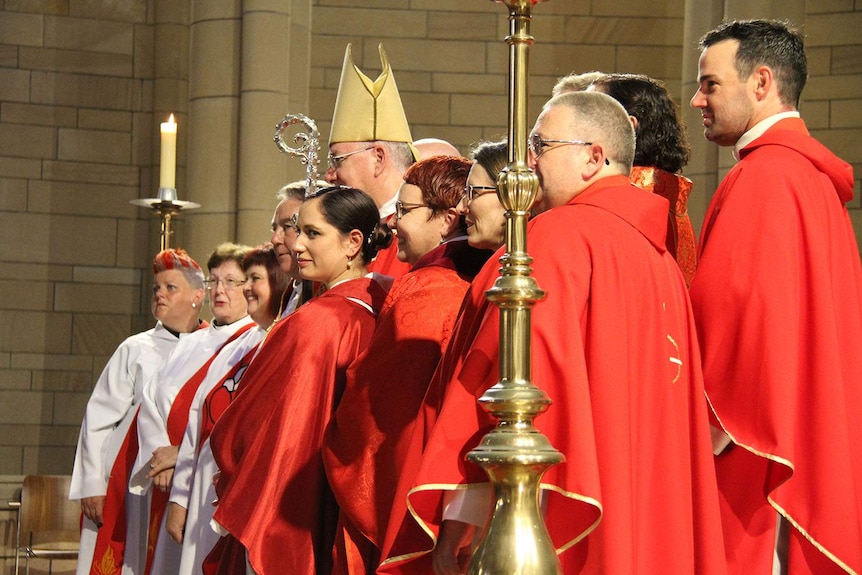 Anglican Archbishop of Brisbane with newly ordained priests and deacons