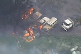 Aerial vision of cars in flames.