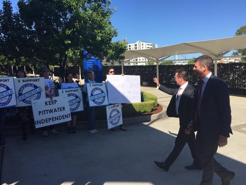Mike Baird heckled by protesters