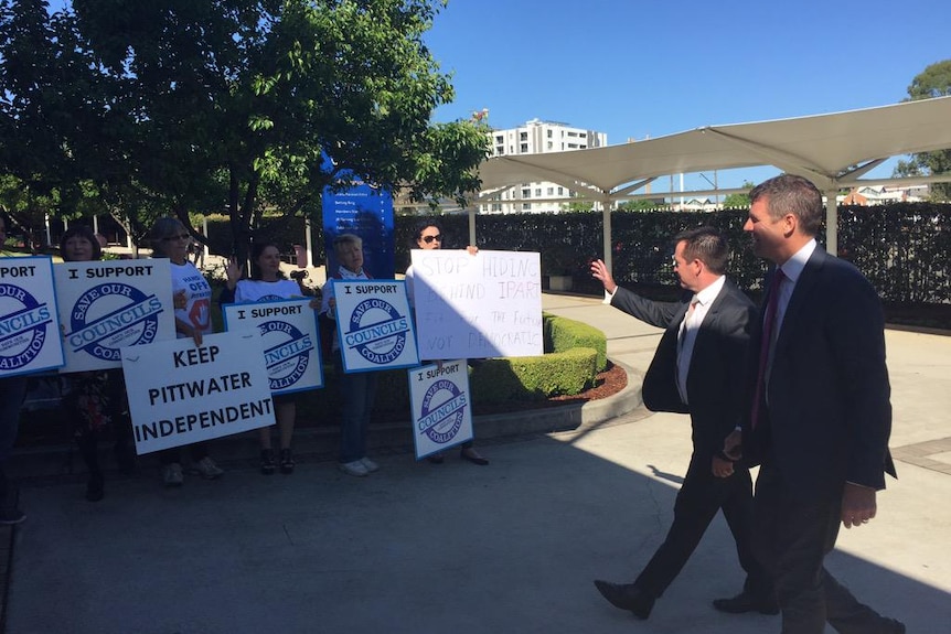Mike Baird heckled by protesters