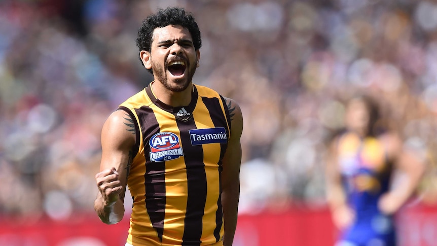 Cyril Rioli celebrates a Hawthorn goal