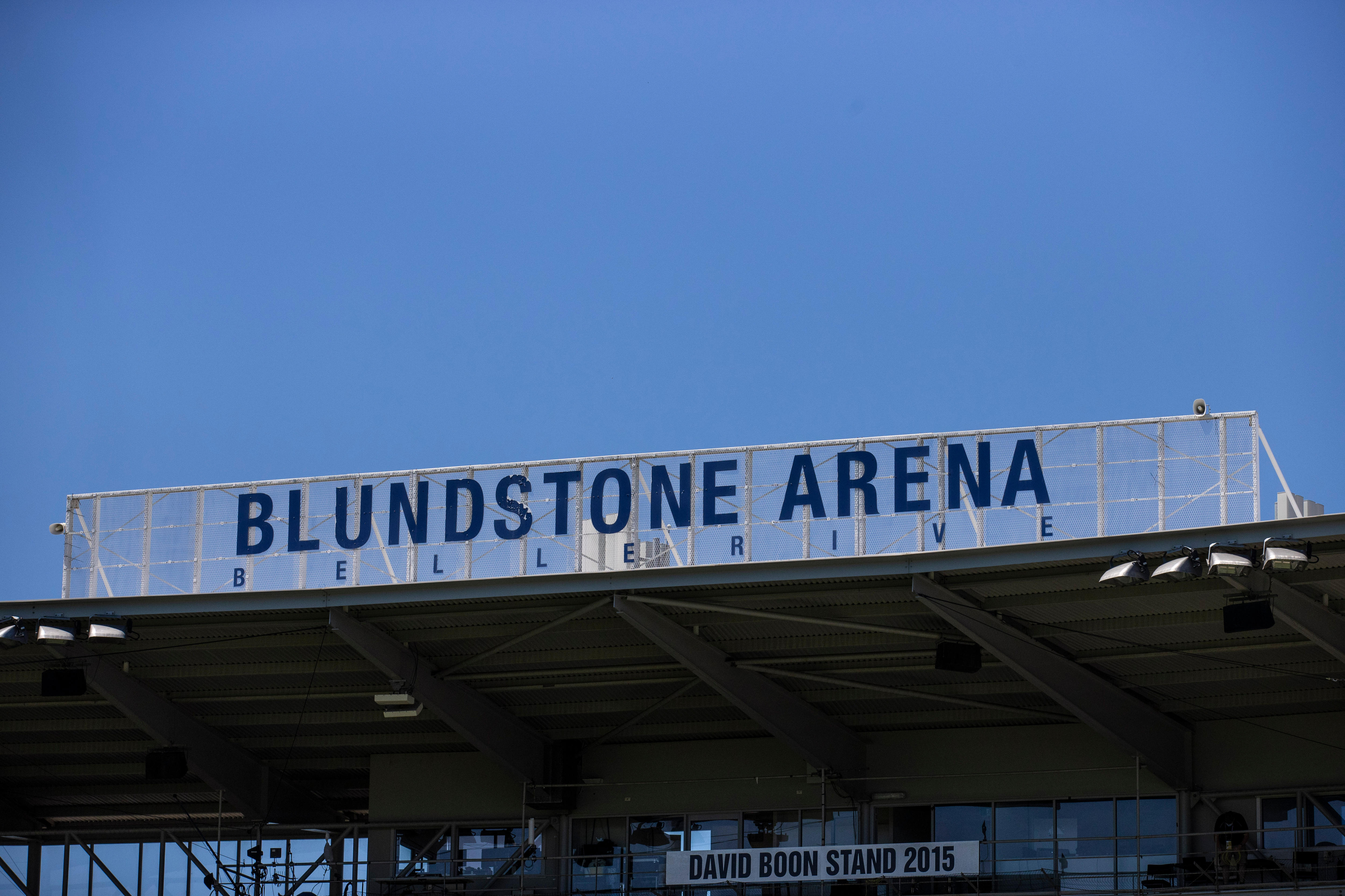 Blundstone Arean signage above the David Boon stand against a blue sky 