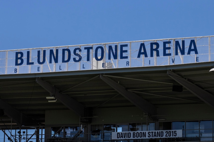Blundstone Arean signage above the David Boon stand against a blue sky 