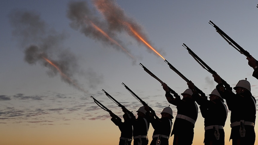 Members of the Albert Battery shoot a volley of fire during the Anzac Day dawn service at Currumbin Surf Life Saving Club on the Gold Coast on Saturday, April 25, 2015.