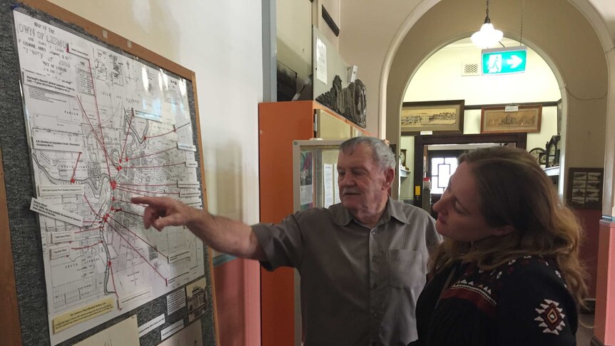Ted Trudgeon and Amanda Shoebridge looking at a map of the Wilsons River