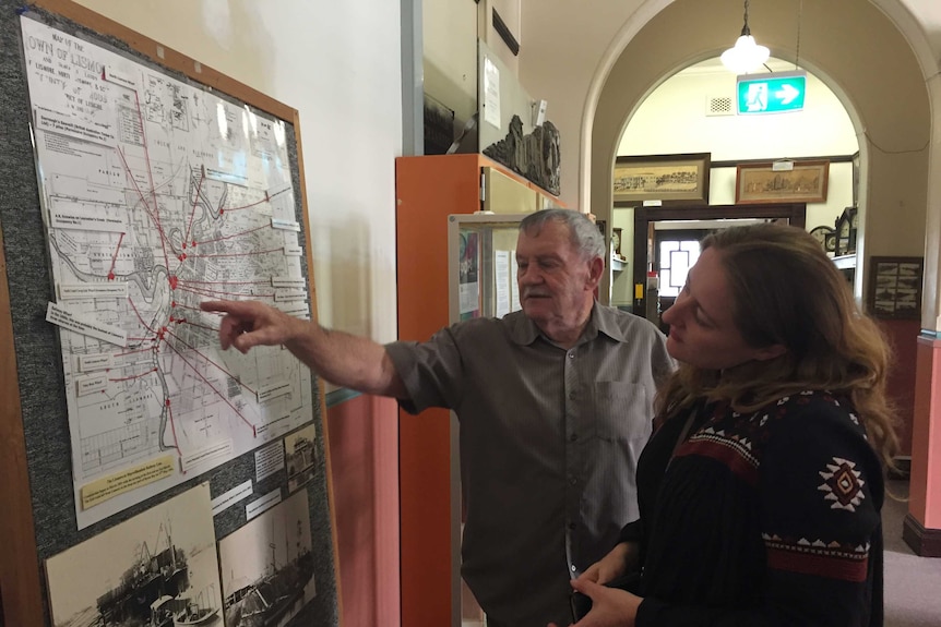 Ted Trudgeon and Amanda Shoebridge looking at a map of the Wilsons River