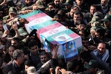 Iranians carry the coffin of Brigadier General Hamid Taghavi
