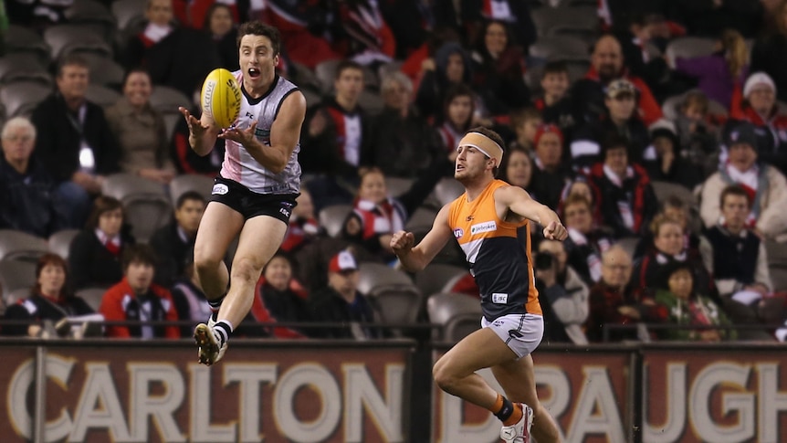 Milne flies high to grab a mark