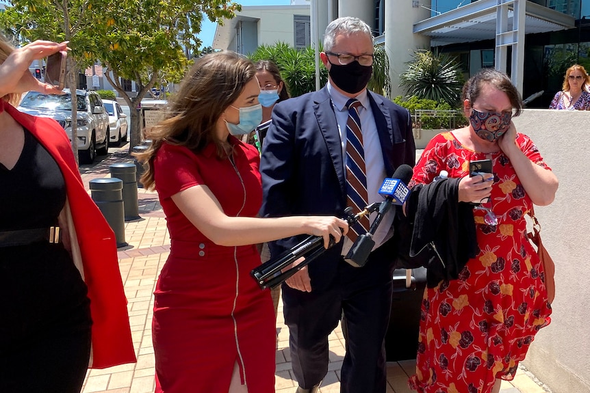 Former lawyer Tracey Smith confronted by reporters outside court